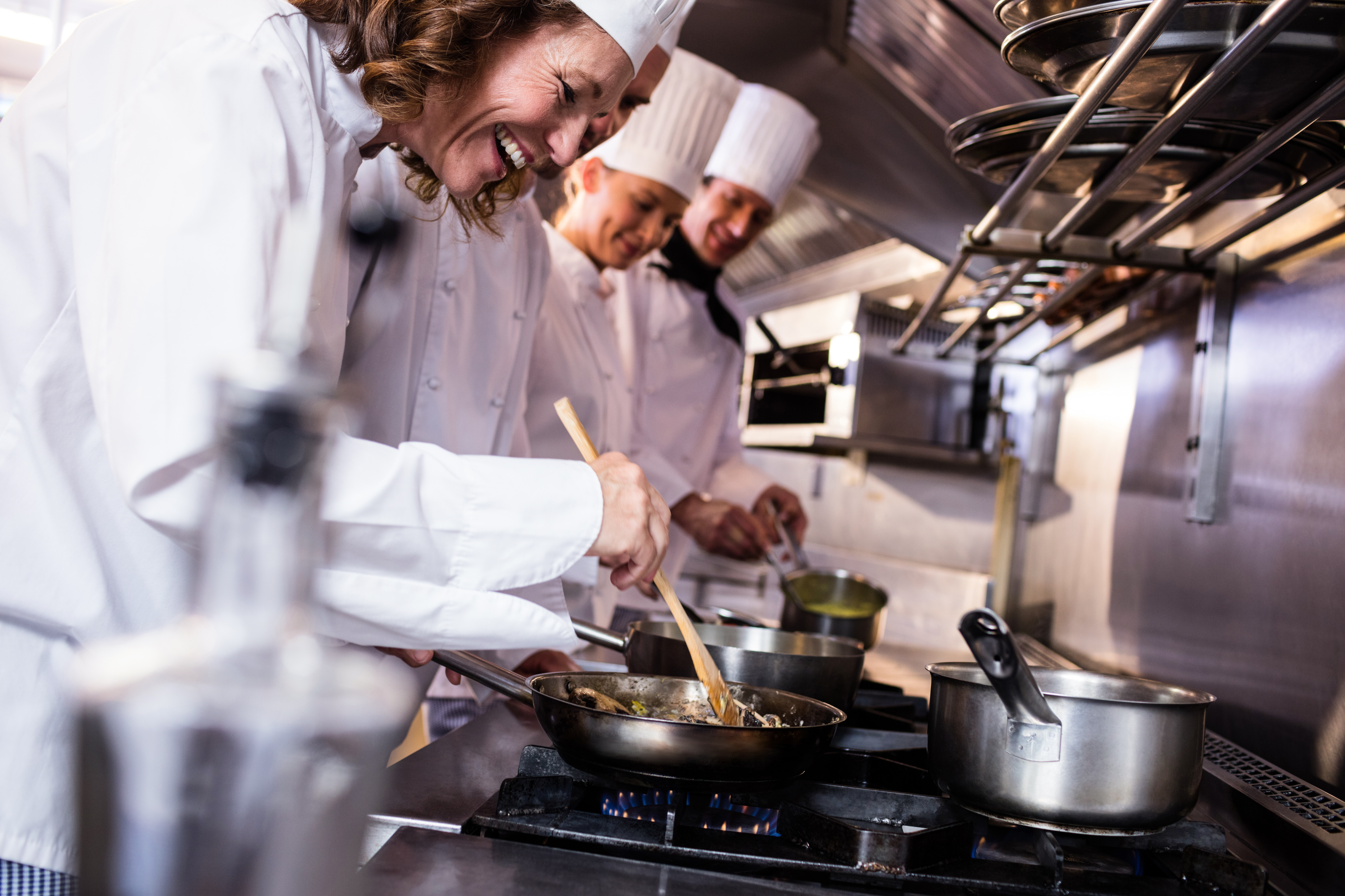 Chefs preparing food in the kitchen